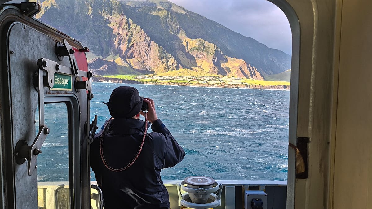 Royal Navy patrol ship HMS Medway at sea approaching remote Tristan da Cunha island