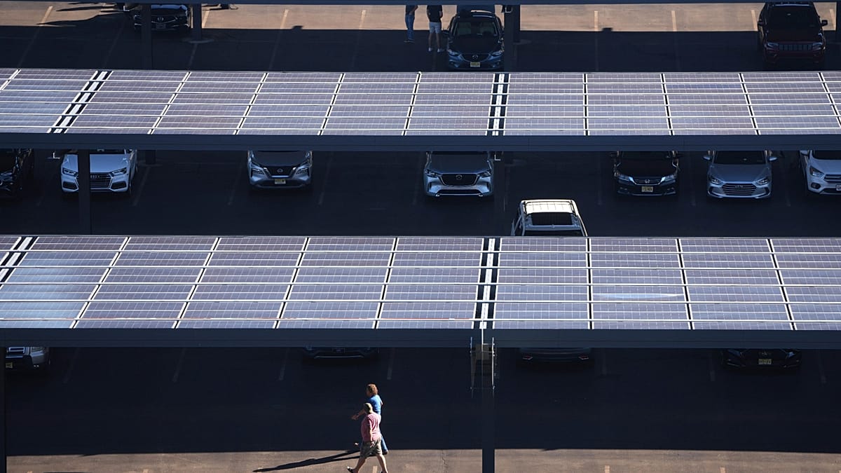 Solar panels and wind turbines generating clean renewable energy across European landscape