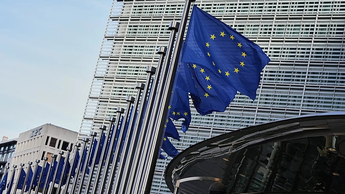 Pro-European Union campaigners holding EU flags near UK Parliament building in London