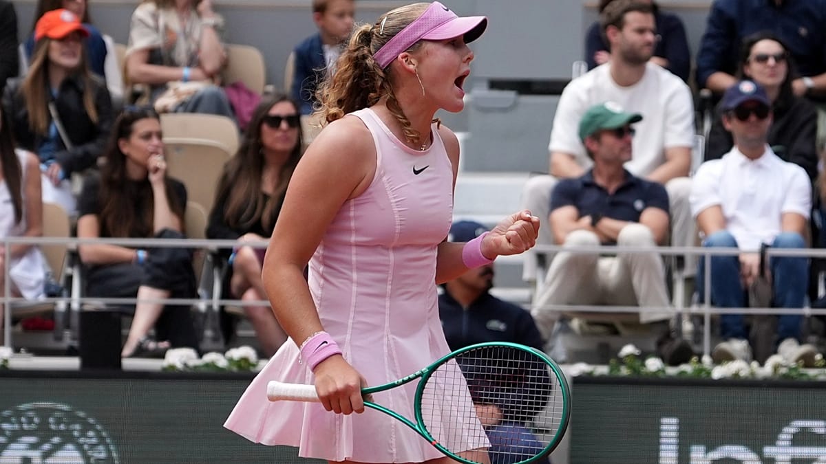 Mirra Andreeva celebrating with trophy after winning French Open tennis championship in Paris