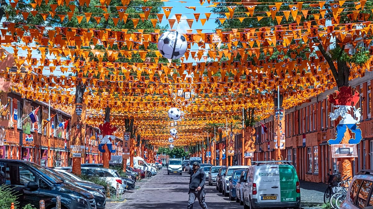 Orange flags and banners completely covering residential street in The Hague Netherlands for World Cup celebration