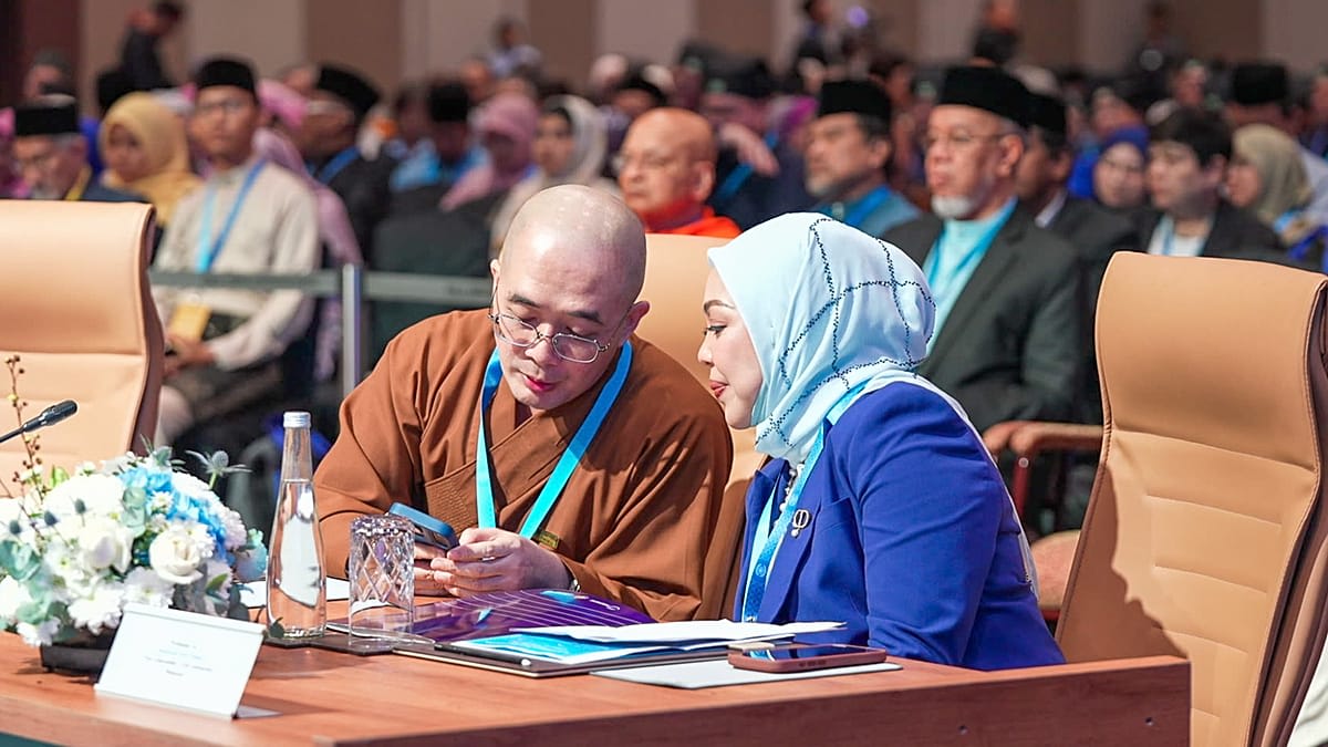 Diverse religious leaders and young students gathered together at interfaith summit in Kuala Lumpur, Malaysia