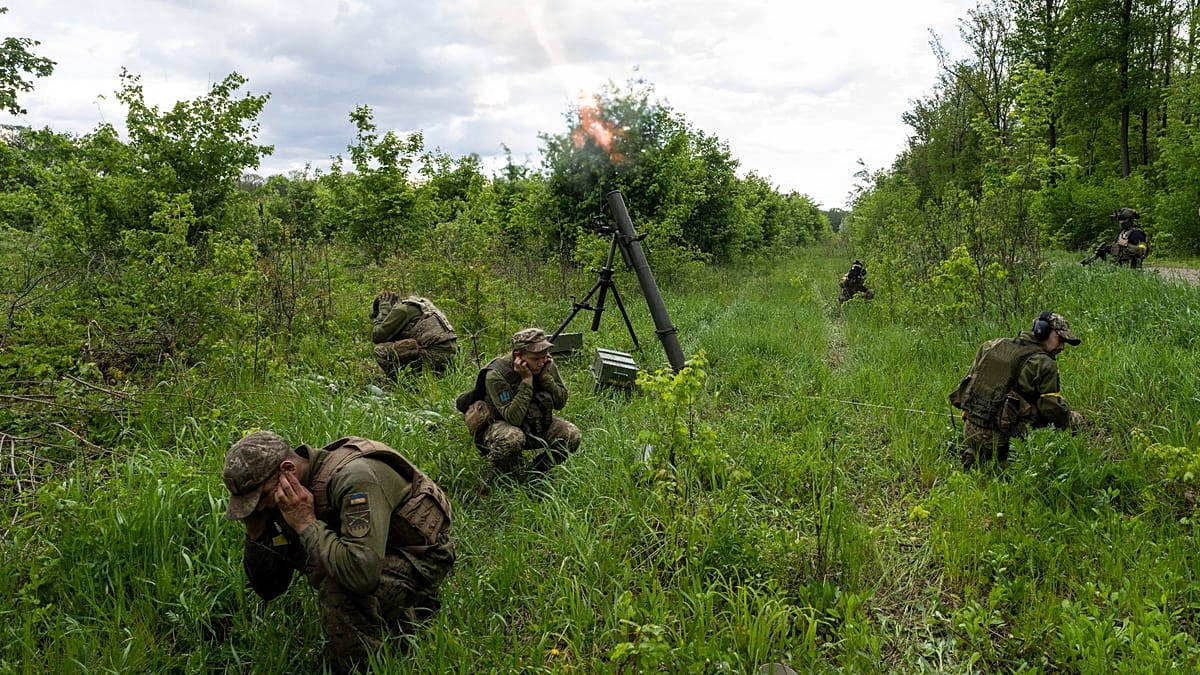 French volunteers training with military equipment alongside Ukrainian International Legion instructors in combat preparation