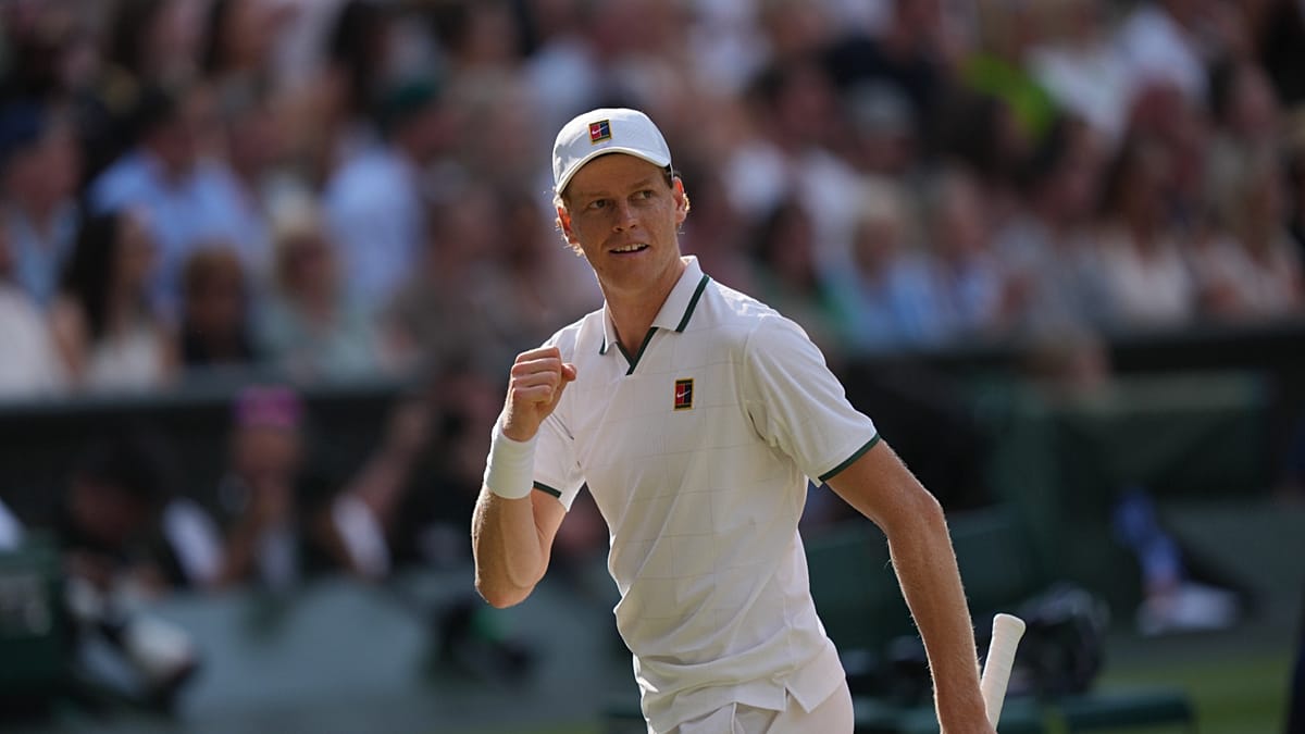 Jannik Sinner serving powerfully during his dominant Wimbledon semifinal victory over Novak Djokovic