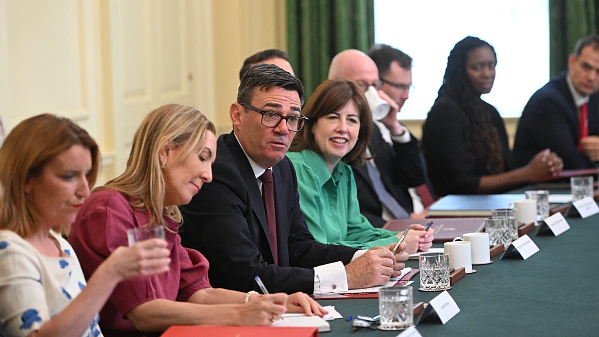British household checking reduced electricity bill showing new tax savings under government policy