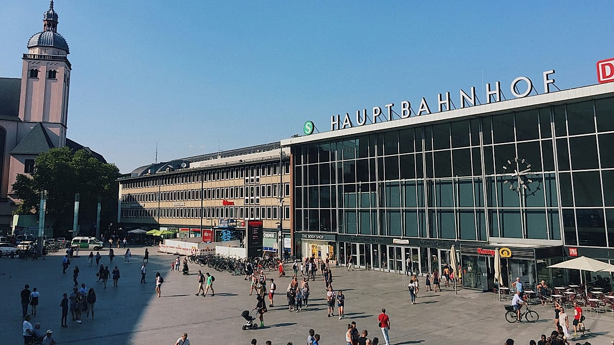 Modern Deutsche Bahn train station platform with passengers waiting safely for trains