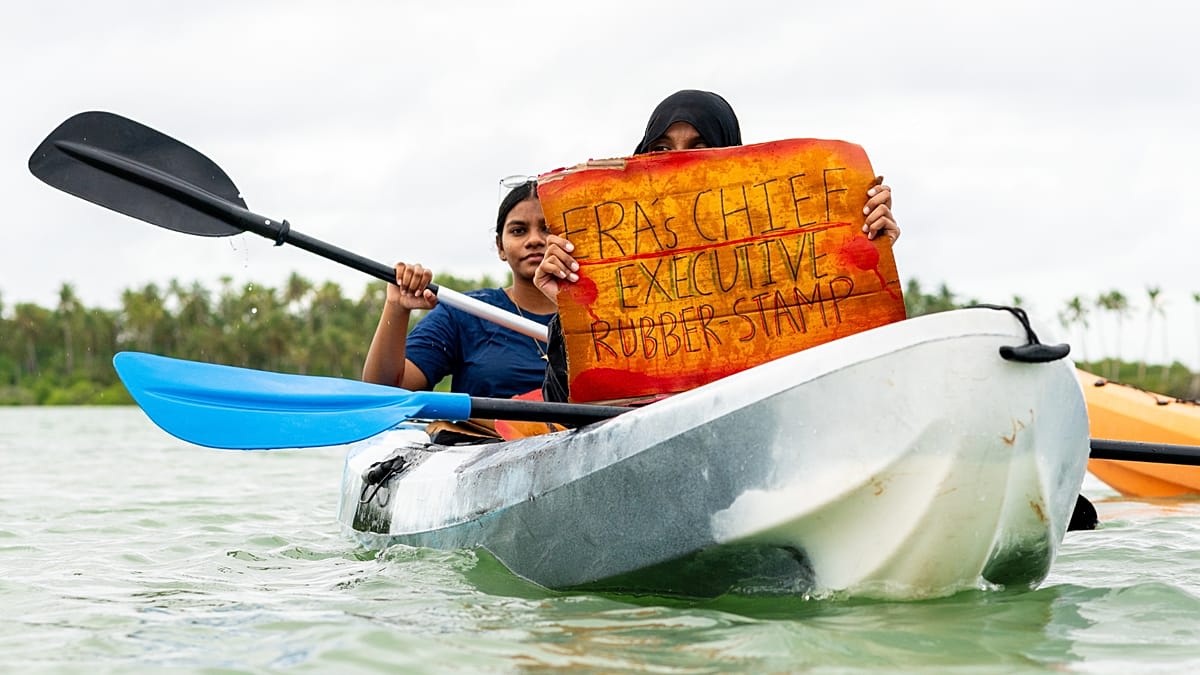 Young Maldivian activists in kayaks protesting land reclamation project damaging protected mangroves