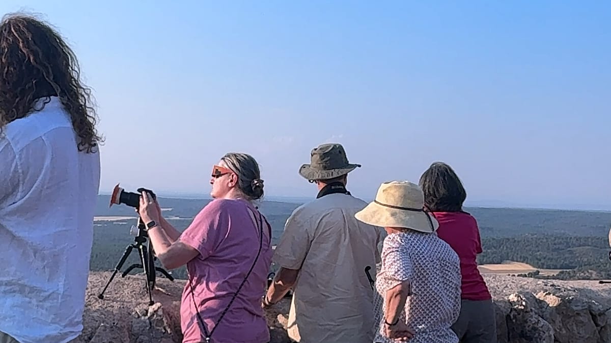 Historic stone fortress of Gormaz overlooking Spanish countryside during total solar eclipse