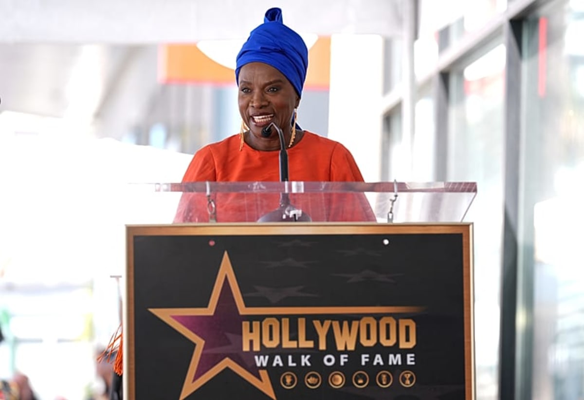 Angélique Kidjo smiling at her Hollywood Walk of Fame star ceremony in Los Angeles