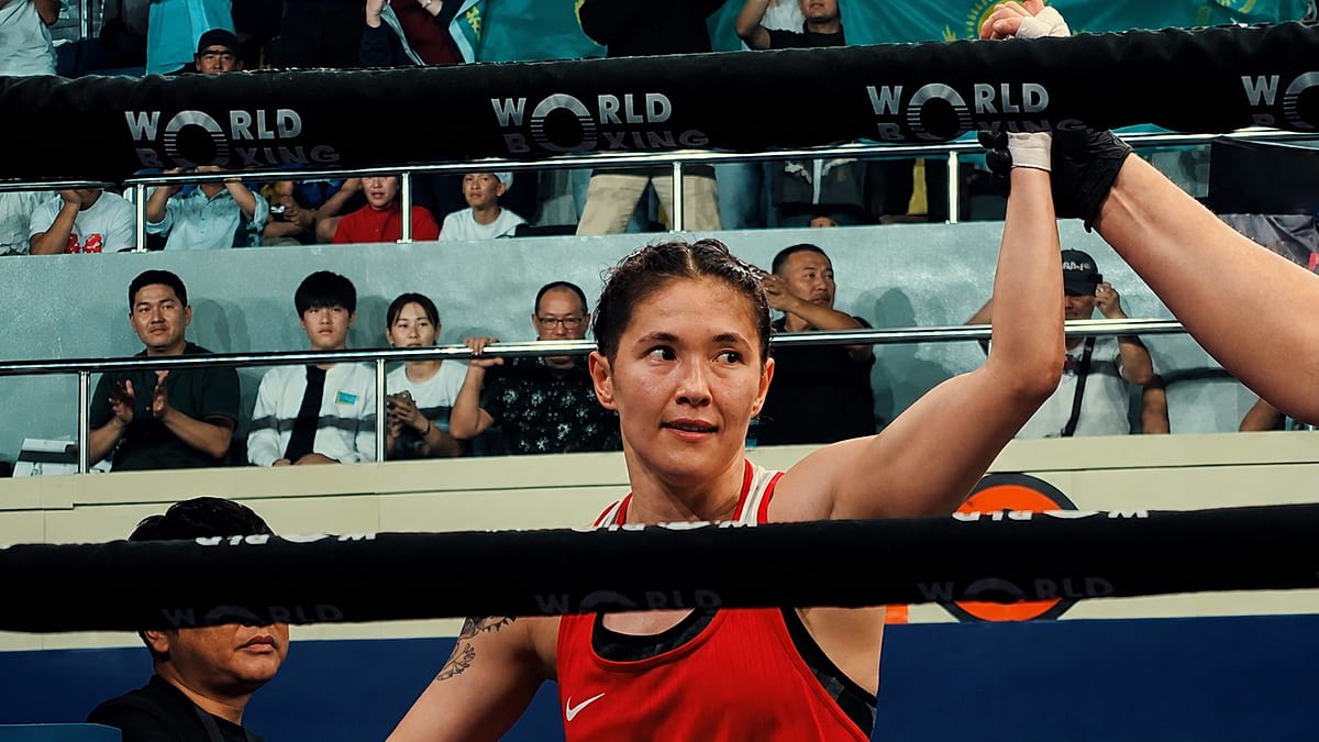 ** Female boxer Nazym Kyzaibay from Kazakhstan celebrating with Olympic bronze medal around her neck