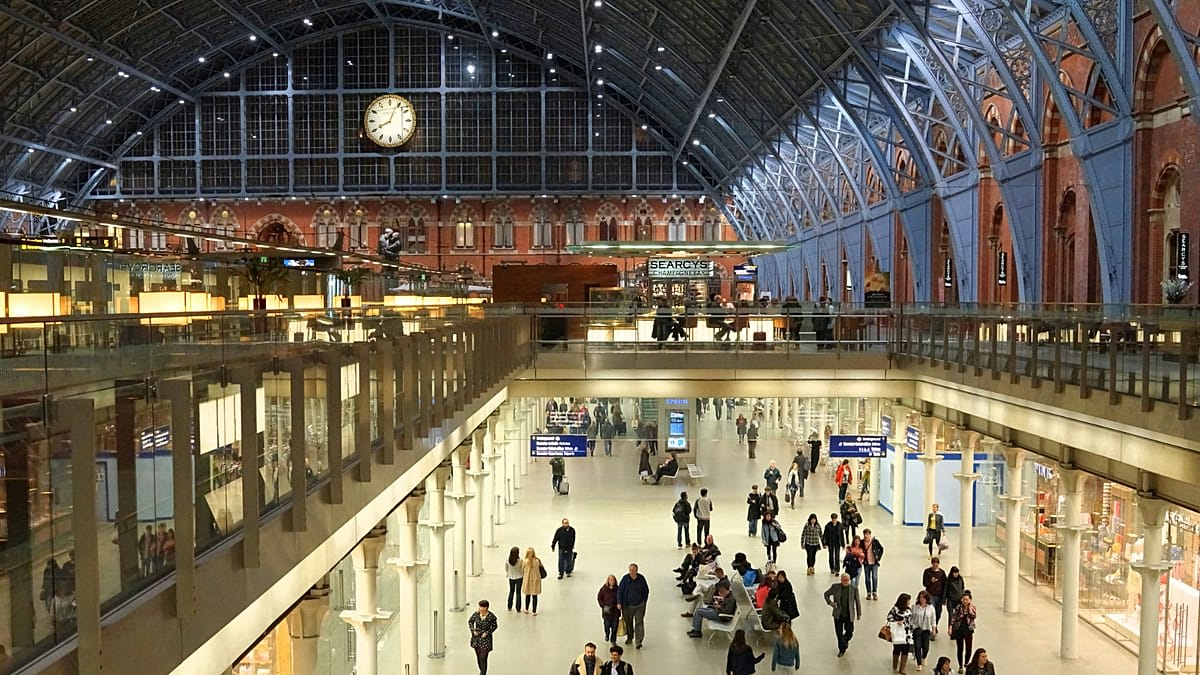 ** High-speed Eurostar train departing London St Pancras station platform toward European destinations