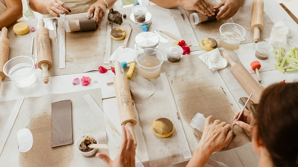 Travelers learning traditional cooking skills during a hands-on culinary class abroad