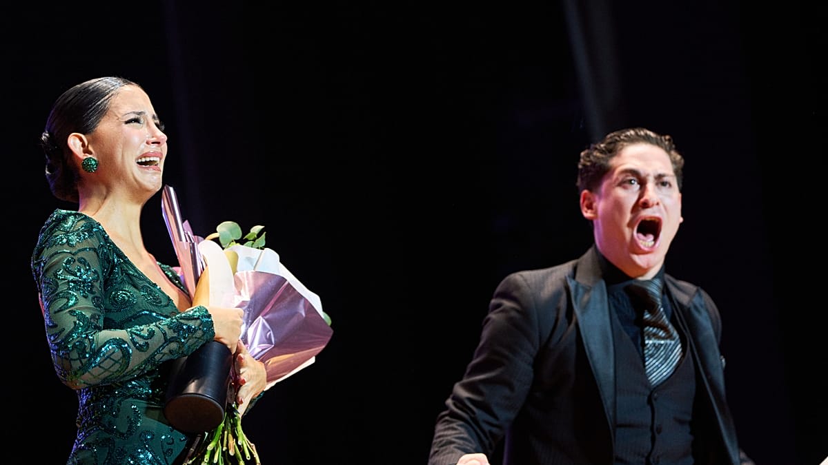Greek and Argentine dancers embrace after winning world tango championship in Buenos Aires