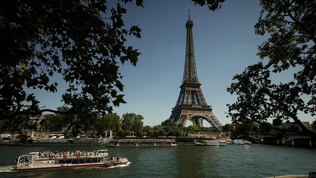 The iconic Eiffel Tower standing tall against the Paris skyline on a clear day