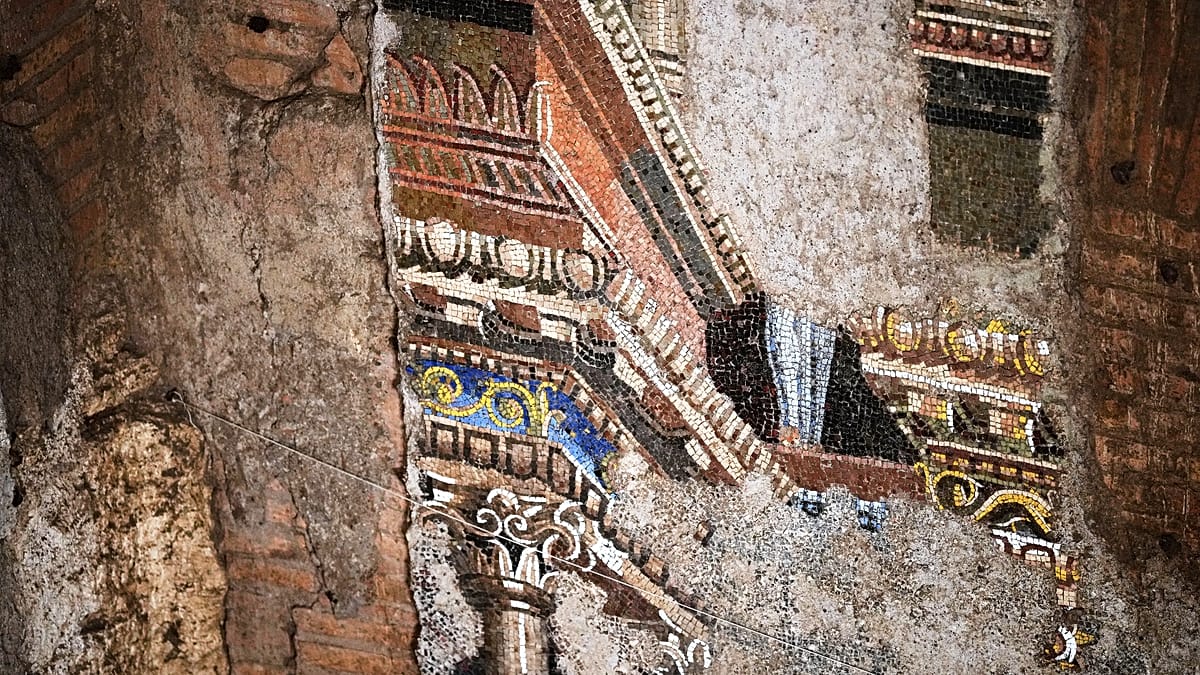 Restored ancient Roman wall mosaic showing detailed harbor city scenes across multiple levels
