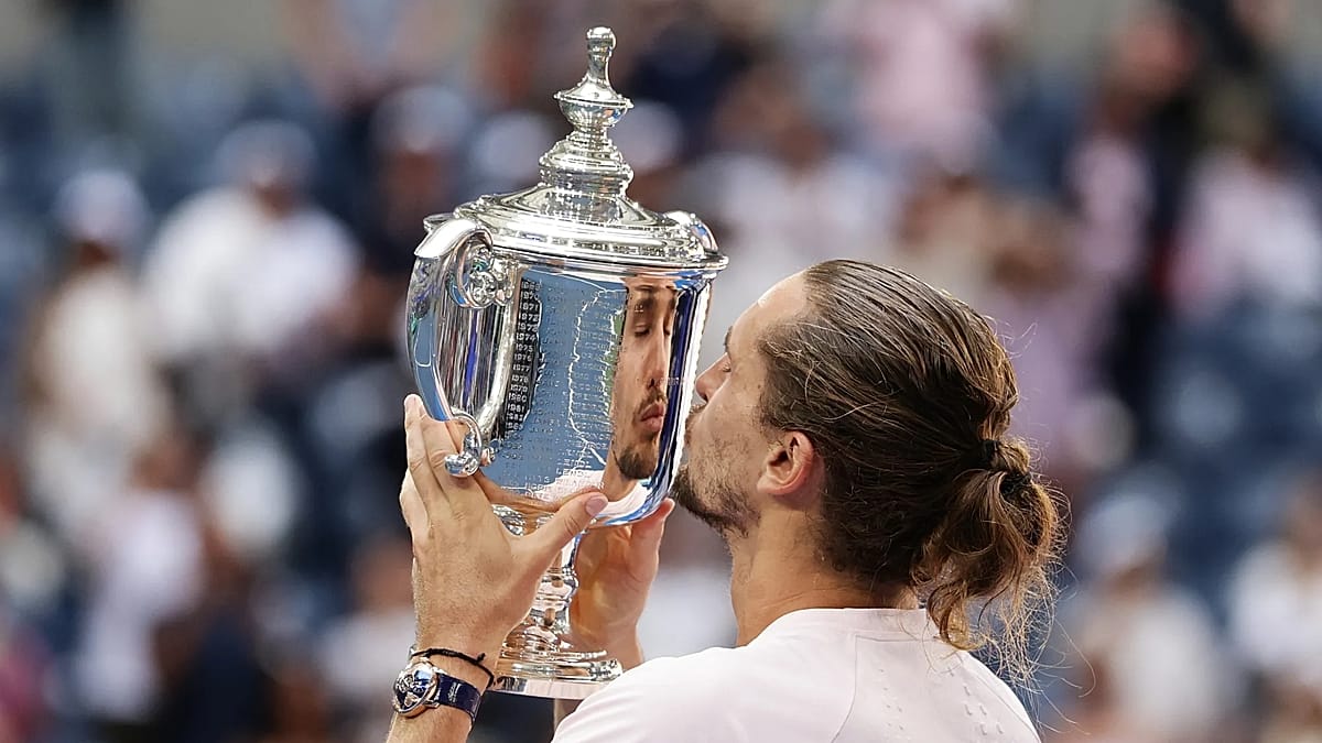 Alexander Zverev holding US Open trophy after defeating Ben Shelton in final