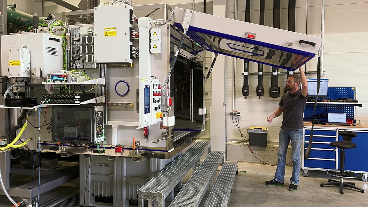 Large industrial battery testing chamber with temperature controls and monitoring equipment inside DEKRA facility