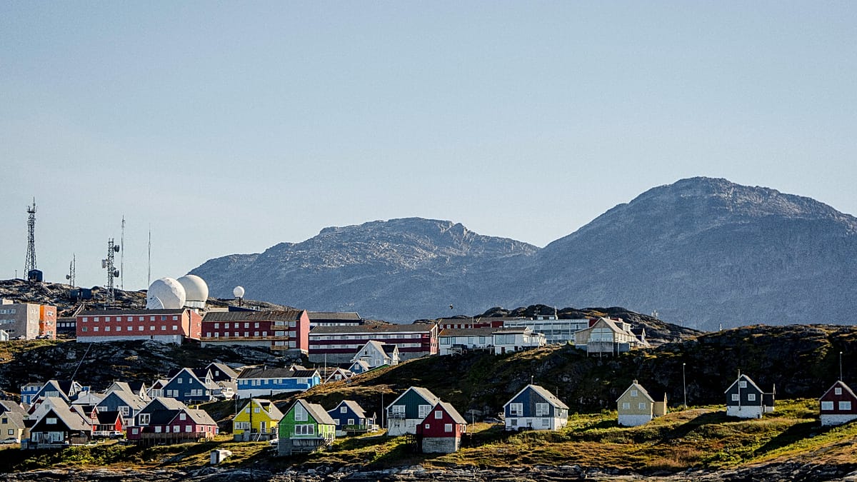 Greenland's coastal landscape with mountains and ice, representing the strategically important Arctic territory