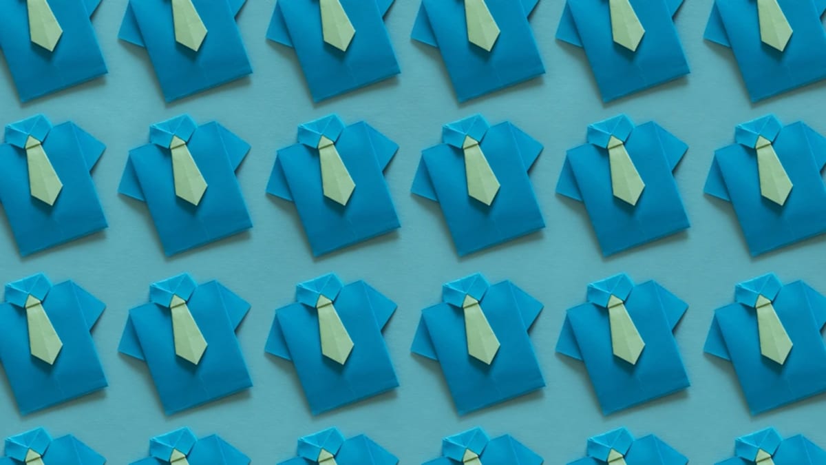 Professional worker collaborating with AI technology on computer showing rising wage growth charts