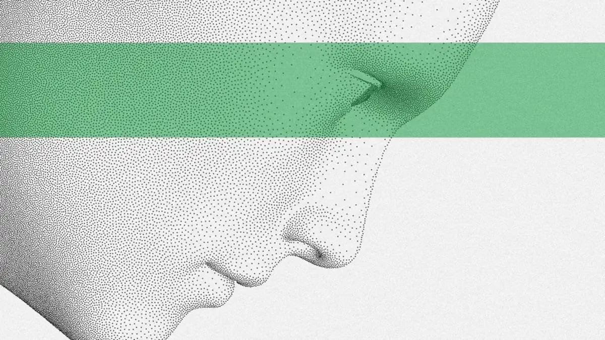 Person using smartphone to search with AI while comparing results on laptop screen