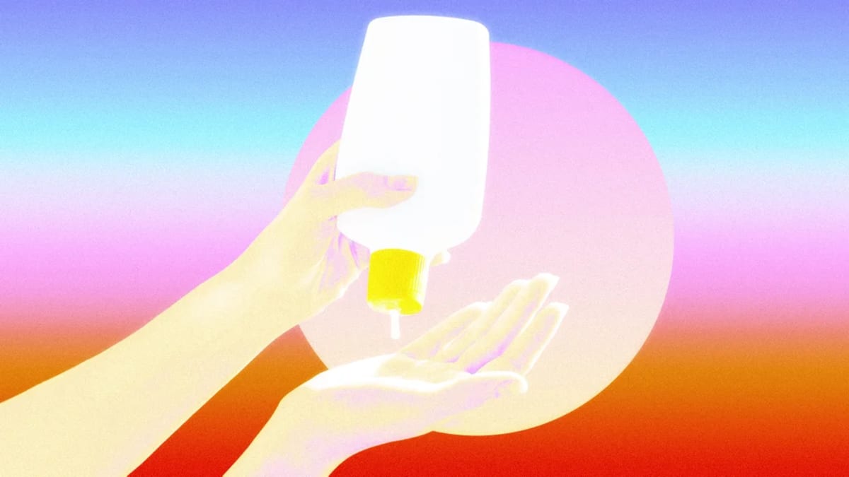 Person applying sunscreen lotion to arm on sunny beach day representing improved sun protection