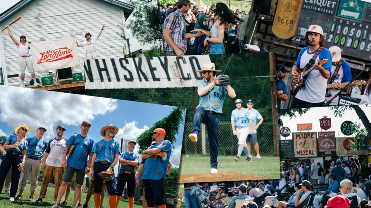 Baseball players in vintage jerseys at The Long Time field with neon baseball sign above trees