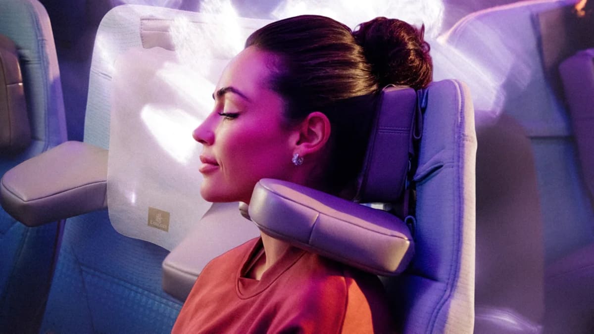 Emirates economy seat showing adjustable U-Dream headrest with foldable wings for neck support