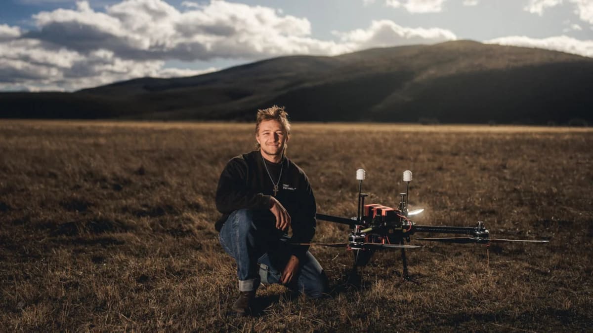 Rainmaker drone flying into storm clouds to release precipitation-generating particles over drought affected landscape