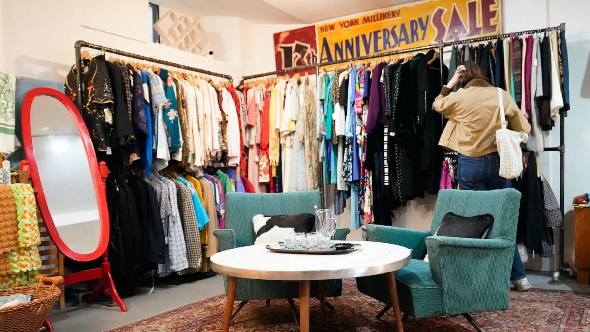 Person browsing quality secondhand furniture at local thrift store or estate sale