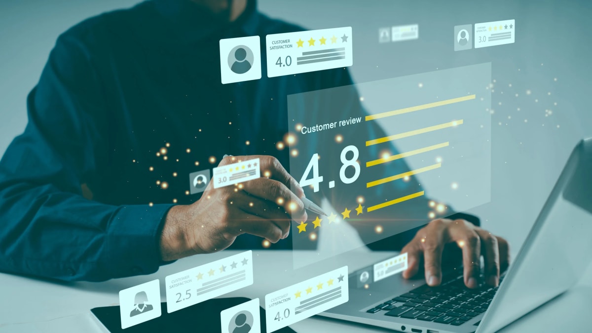 Business team having supportive coaching conversation in modern office workspace showing positive workplace culture