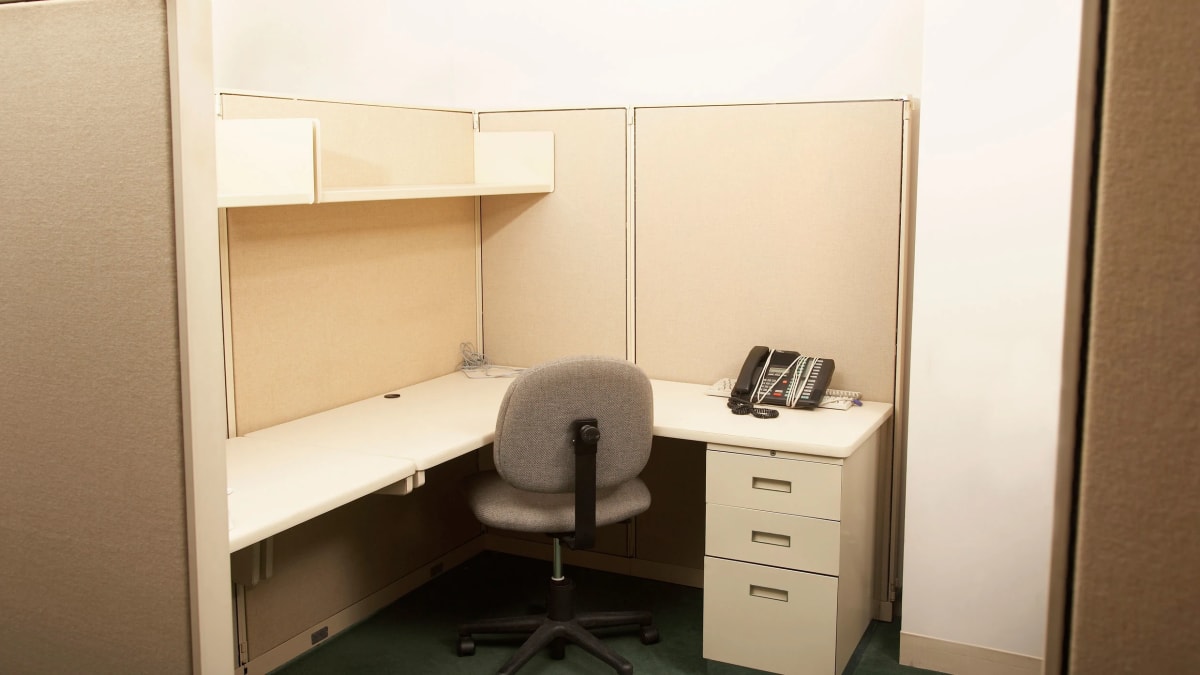 Professional sitting thoughtfully at desk reflecting on career transition and future opportunities