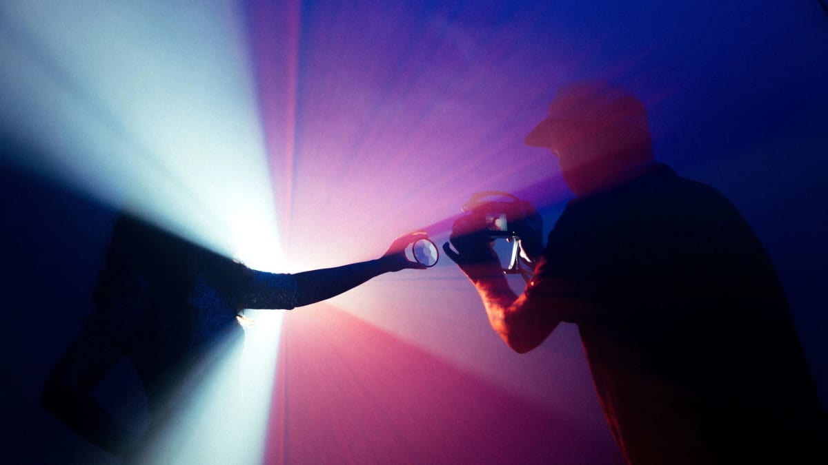 Person enjoying a peaceful creative moment with art supplies and journal in morning sunlight