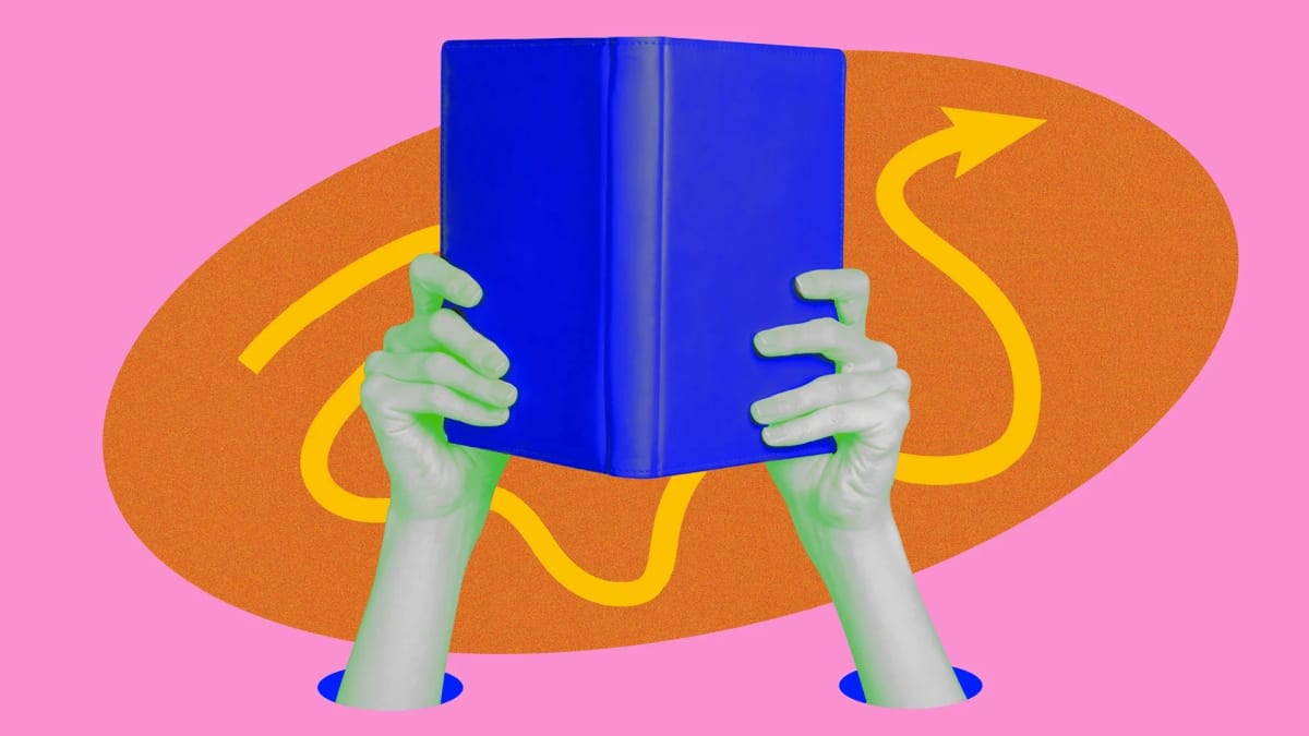 Person peacefully reading a book while sitting in comfortable chair with focused expression