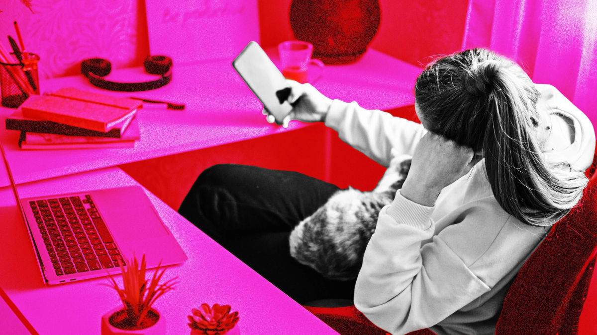 Person working peacefully at organized desk with phone stored away from workspace