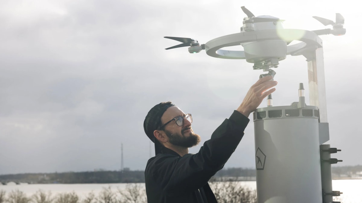 Workers assembling Fealty drones in Birdstop's Detroit facility overlooking the river