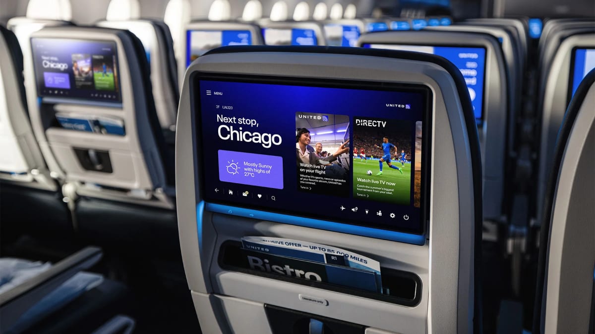 Airplane passenger watching live soccer match on device using in-flight Wi-Fi streaming service