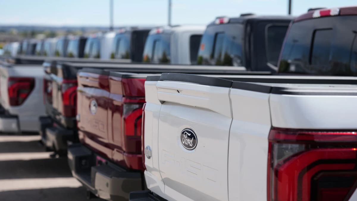Ford F-150 pickup truck plugged into home electrical system providing backup power during outage
