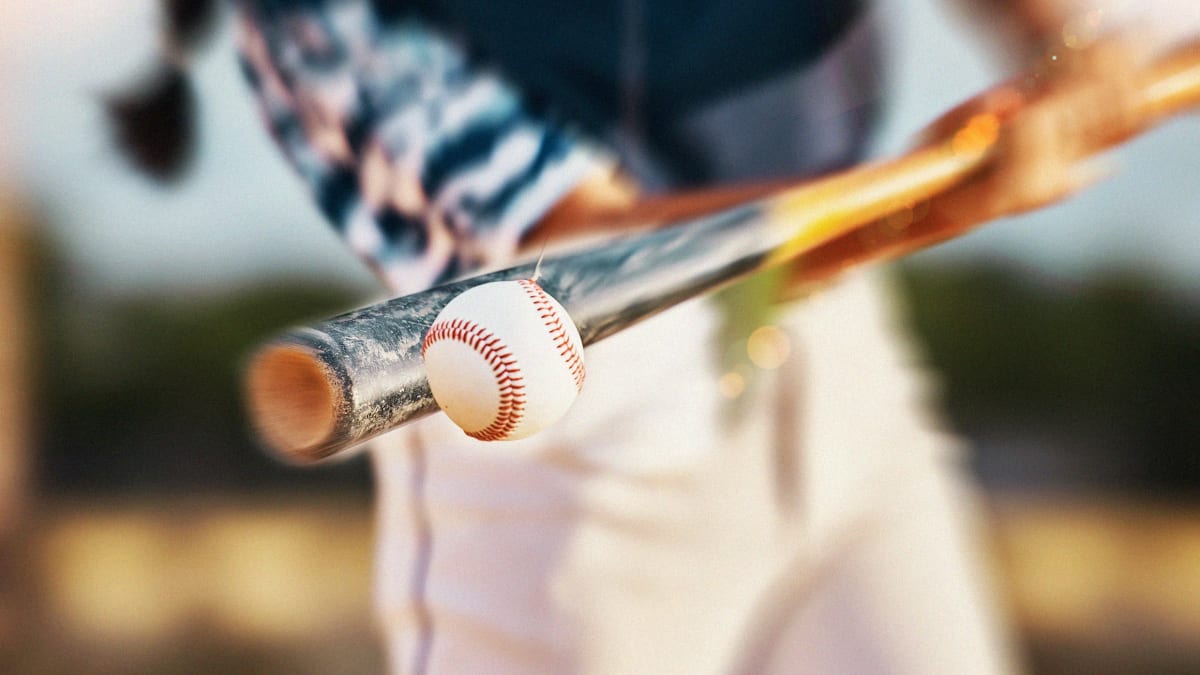 Visually impaired athlete Kiana Glanton playing blind baseball in competitive sports uniform