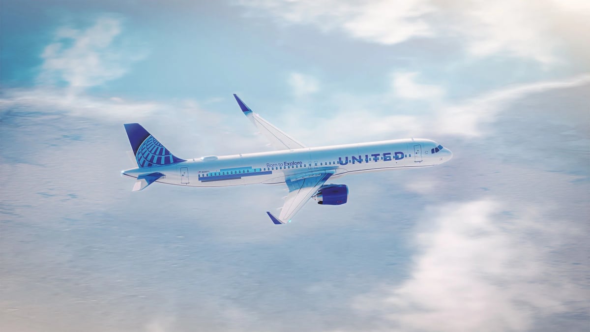 United Airlines cabin interior showing new shared table replacing traditional middle airplane seat