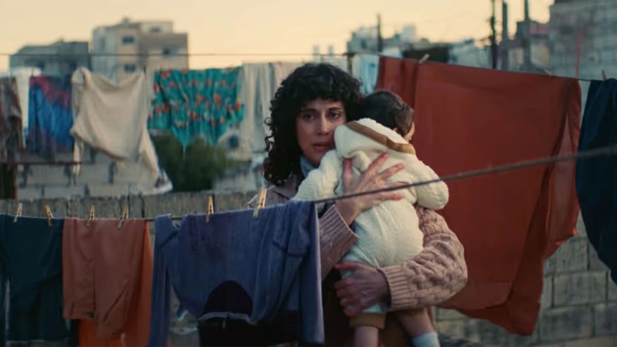 Filmmaker Cherien Dabis standing confidently, director of award-winning independent Palestinian family drama