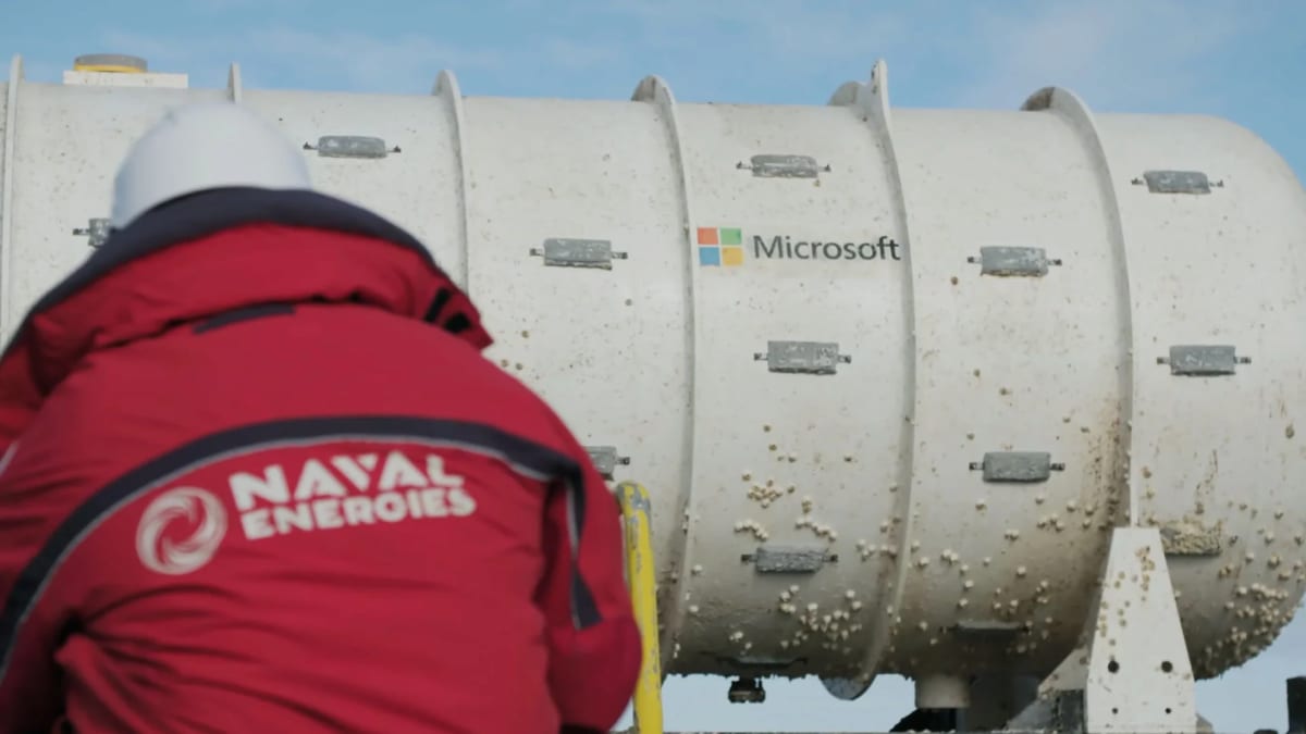 Underwater data center module resting on ocean floor surrounded by marine environment