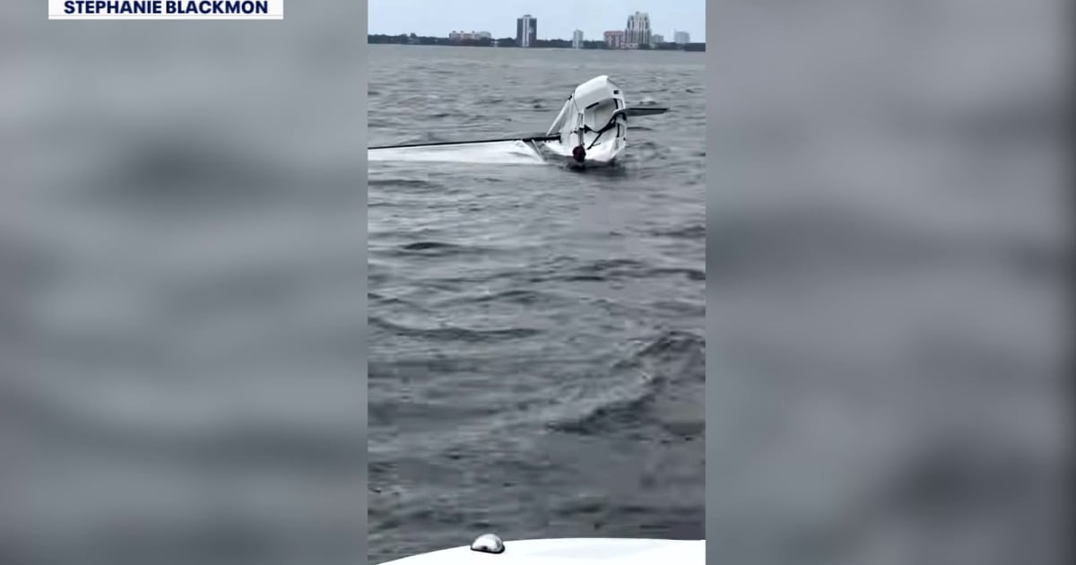 Capsized sailboat in water near Tampa's Davis Islands during rescue operation
