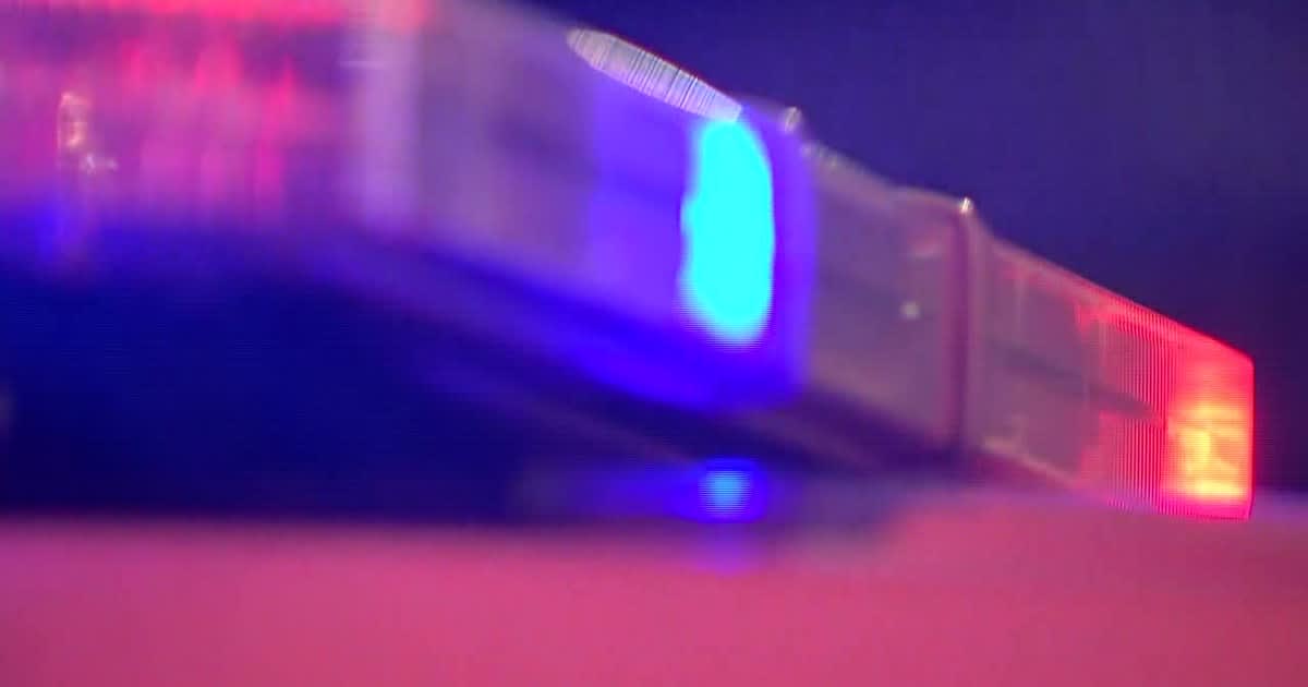Police car lights at nighttime crash scene on South Main Street in Glassboro