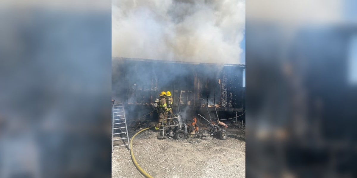 Firefighter helmet camera view showing smoke-filled burning home interior during dog rescue operation