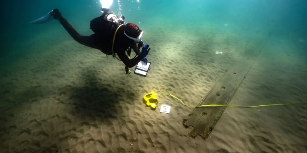 Underwater archaeological site showing ancient shipwreck remains on the seafloor of Gibraltar Bay