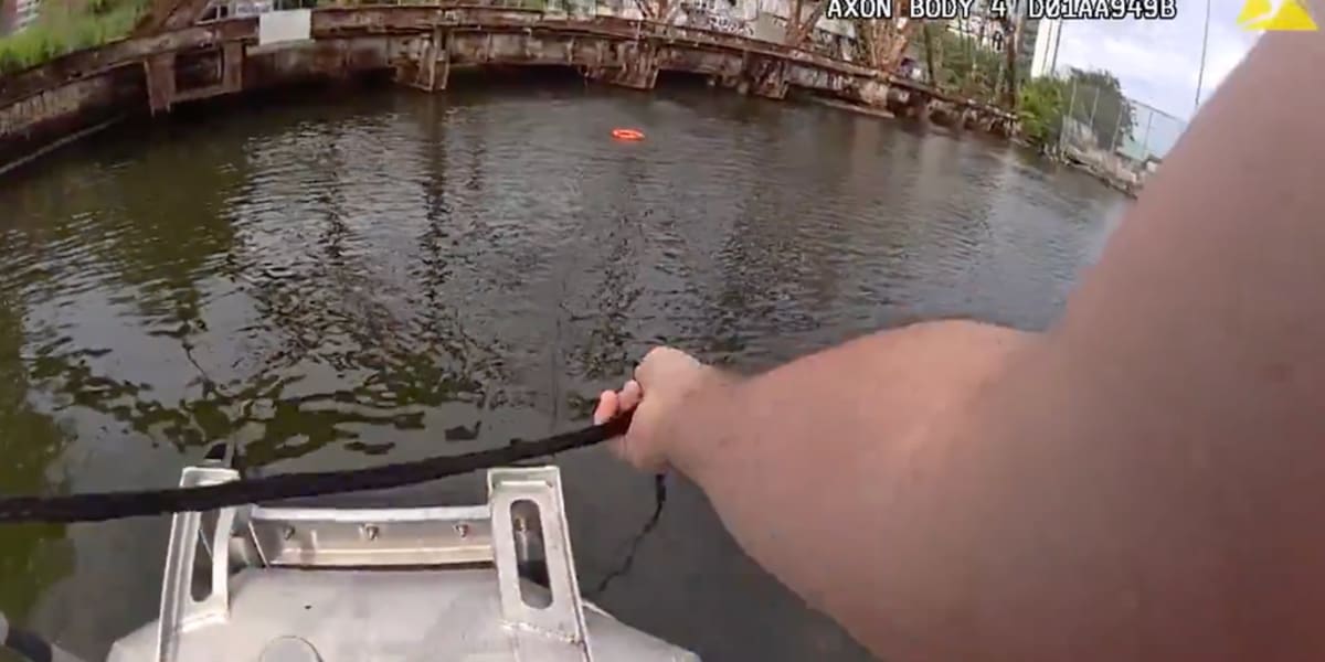 NYPD officer jumping from patrol boat into Newtown Creek to rescue drowning woman