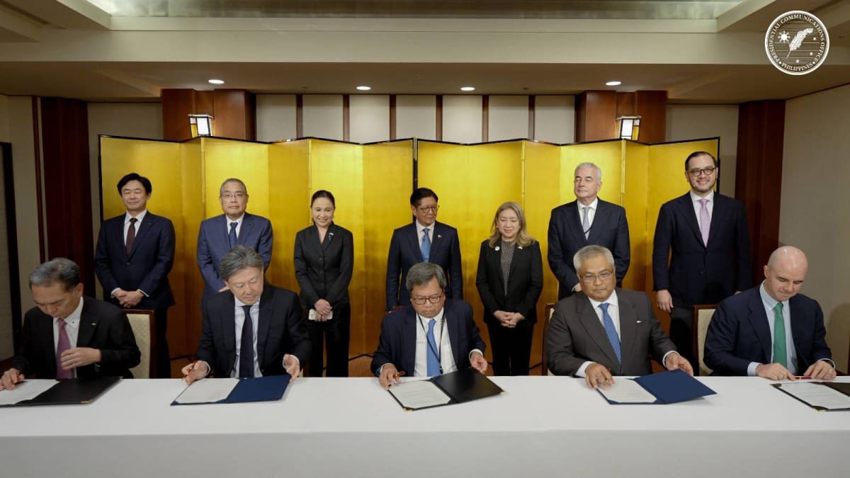 Philippine and Japanese business executives sign partnership agreements while President Marcos observes at Tokyo ceremony