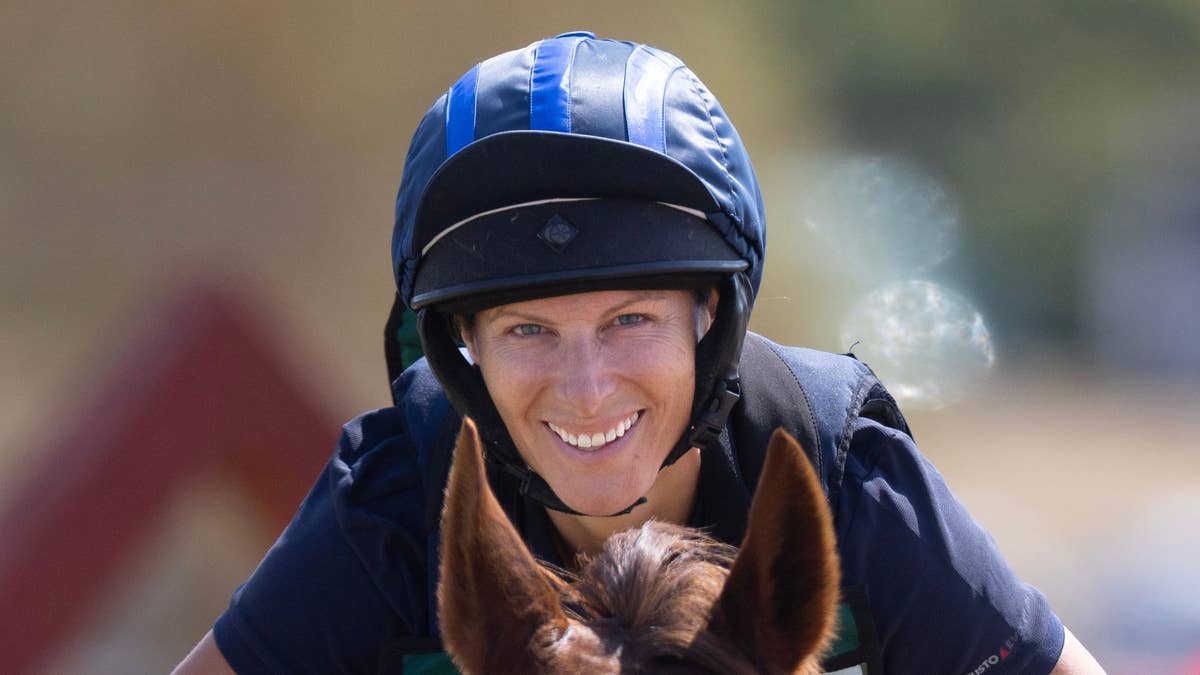 Zara Tindall smiling while riding Class Affair during her championship victory at Hartpury