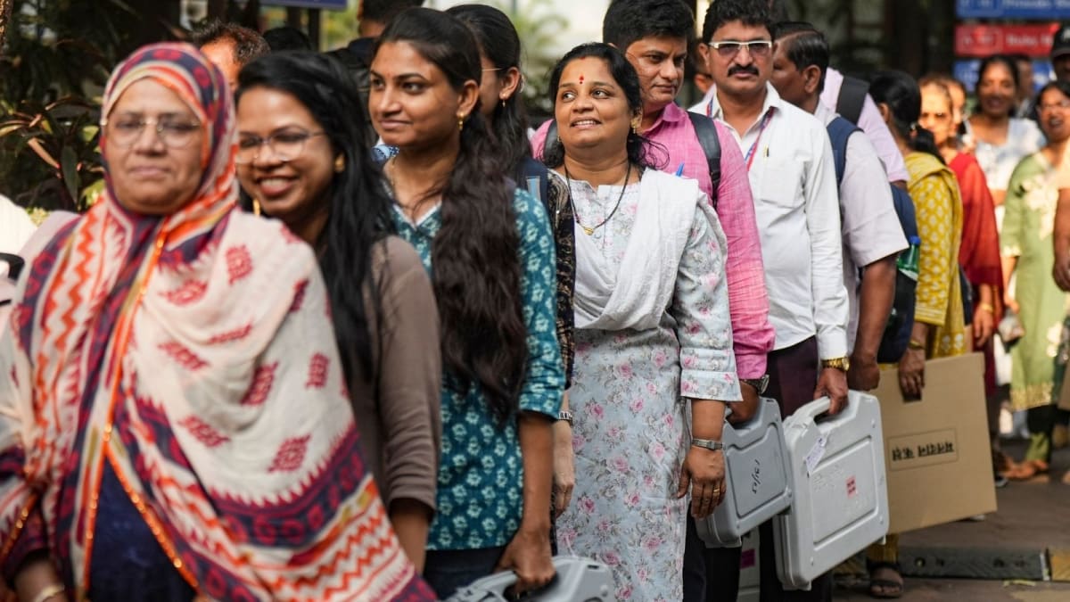 Women election workers in India reviewing ballot counting procedures during training session