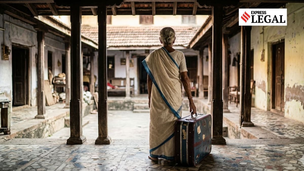 Elderly Indian woman in traditional clothing smiling with relief after winning court case